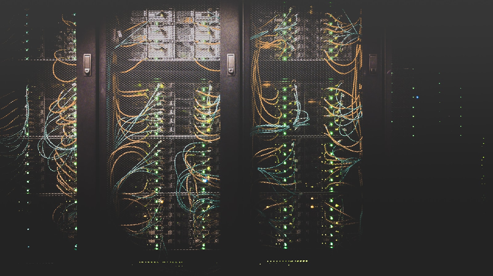 Rows of server racks in a modern data center hall illustrating IT asset complexity